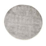A round, textured grey rug with a thin white border